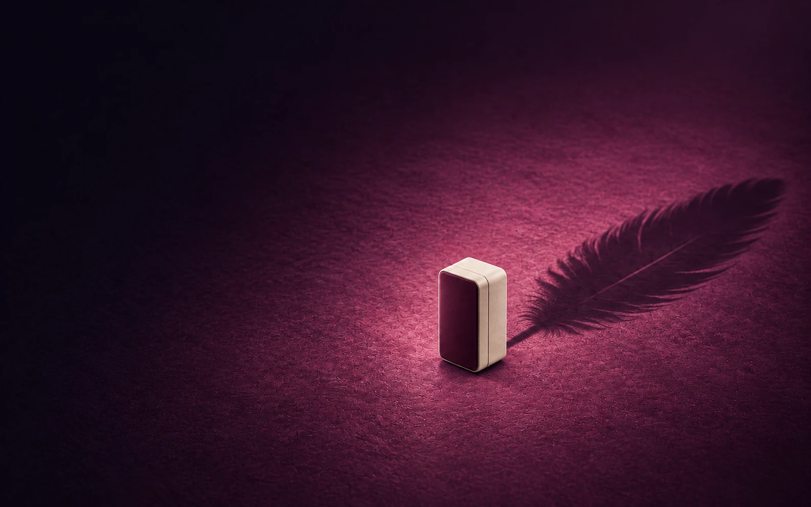 An ivory and burgundy product casts a feather-shaped shadow across a plum floor, a visual metaphor for lightness.